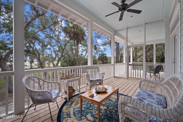 sunroom with ceiling fan and plenty of natural light