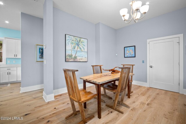 dining area featuring a chandelier and light hardwood / wood-style floors