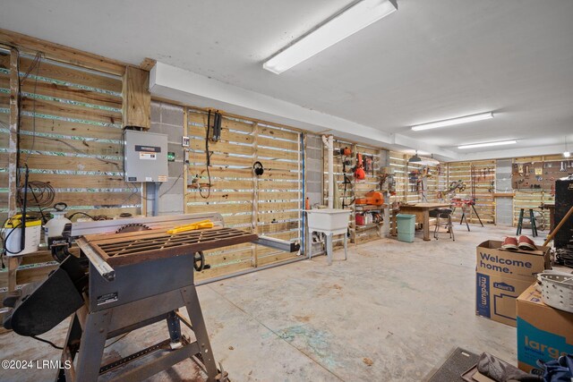 basement with sink and a workshop area