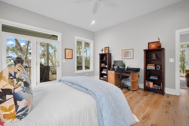 bedroom featuring multiple windows, light wood-type flooring, access to outside, and ceiling fan