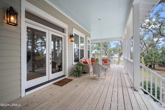 wooden deck featuring covered porch