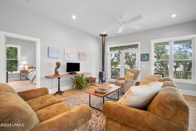 living room featuring light hardwood / wood-style floors and ceiling fan