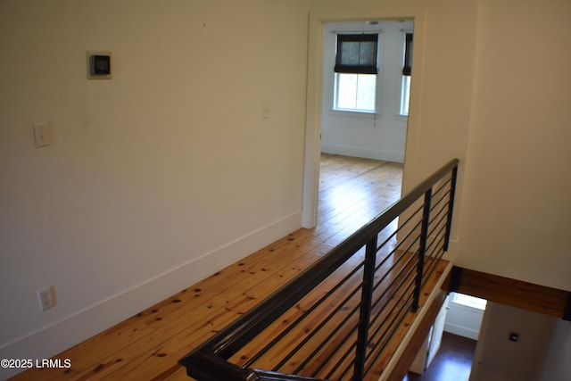 stairway featuring hardwood / wood-style flooring