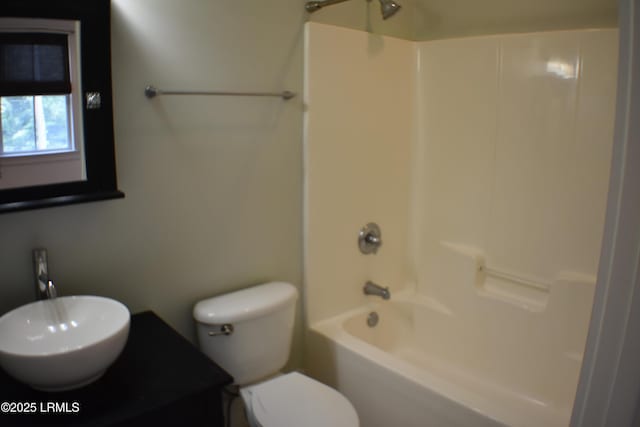 full bathroom featuring  shower combination, toilet, and sink