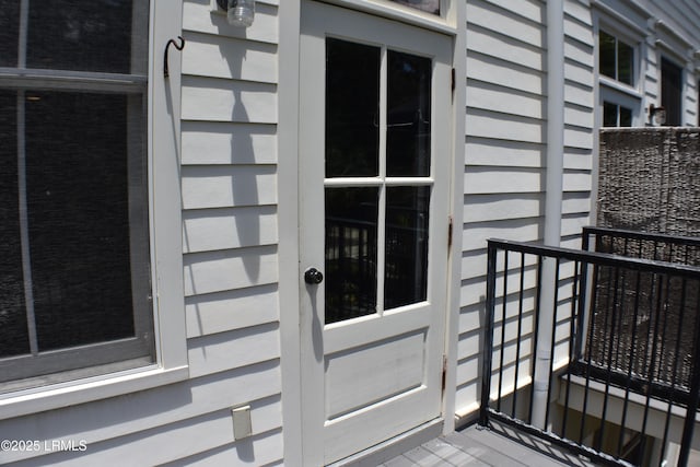 entrance to property with a balcony