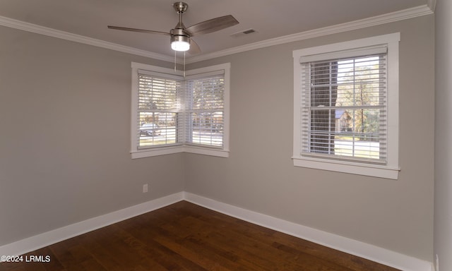 spare room featuring dark wood-type flooring, ceiling fan, and ornamental molding