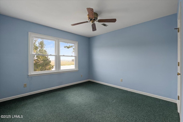 10 Broomfield Ln, Beaufort, SC 29907 - spare room with dark colored carpet, ceiling fan, and baseboards
