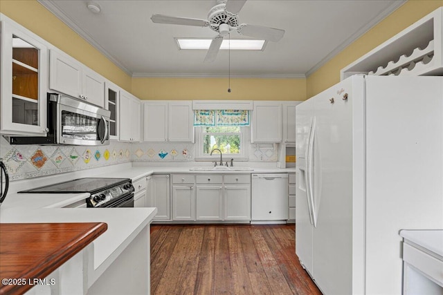 10 Broomfield Ln, Beaufort, SC 29907 - kitchen with white appliances, a sink, a ceiling fan, crown molding, and glass insert cabinets