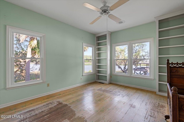 10 Broomfield Ln, Beaufort, SC 29907 - unfurnished office with hardwood / wood-style floors, healthy amount of natural light, baseboards, and ceiling fan
