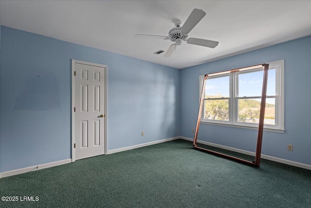 10 Broomfield Ln, Beaufort, SC 29907 - unfurnished room featuring dark carpet, baseboards, and a ceiling fan