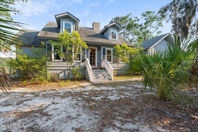 10 Broomfield Ln, Beaufort, SC 29907 - view of front facade featuring a chimney and roof with shingles