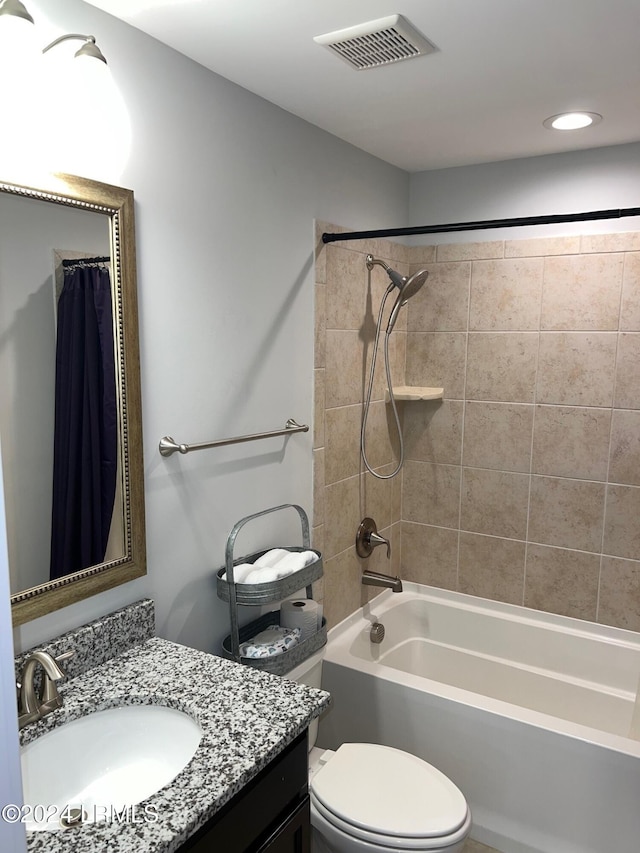 full bathroom featuring shower / bathtub combination with curtain, vanity, and toilet