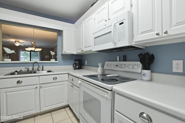 96 Mathews Dr Unit 145, Hilton Head Island, SC 29926 - kitchen featuring white appliances, white cabinets, light countertops, light tile patterned flooring, and a chandelier