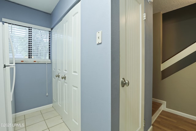 96 Mathews Dr Unit 145, Hilton Head Island, SC 29926 - hallway with baseboards and tile patterned flooring