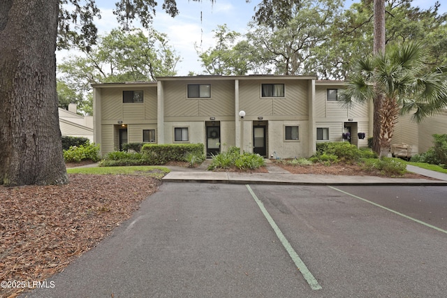 96 Mathews Dr Unit 145, Hilton Head Island, SC 29926 - townhome / multi-family property featuring uncovered parking and stucco siding