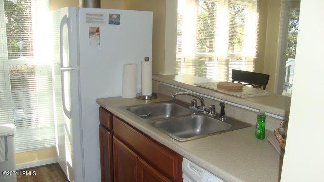 kitchen with white fridge and sink