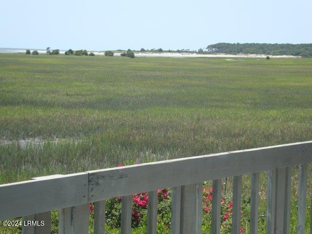 view of yard with a rural view and a balcony