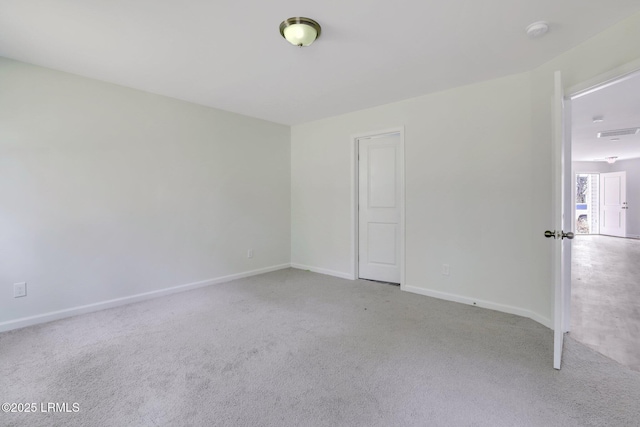 unfurnished bedroom with carpet flooring, visible vents, and baseboards