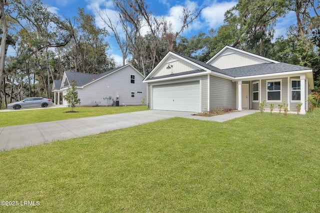 ranch-style house with an attached garage, concrete driveway, a shingled roof, and a front yard