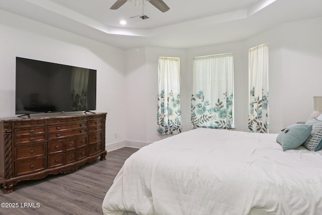 100 Drayton Dr, Ridgeland, SC 29936 - bedroom featuring a tray ceiling, dark wood-style floors, a ceiling fan, and recessed lighting