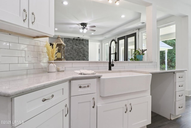 100 Drayton Dr, Ridgeland, SC 29936 - kitchen with decorative backsplash, recessed lighting, white cabinetry, dark wood-style flooring, and ceiling fan