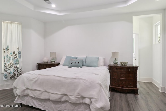 100 Drayton Dr, Ridgeland, SC 29936 - bedroom with a raised ceiling and wood finished floors