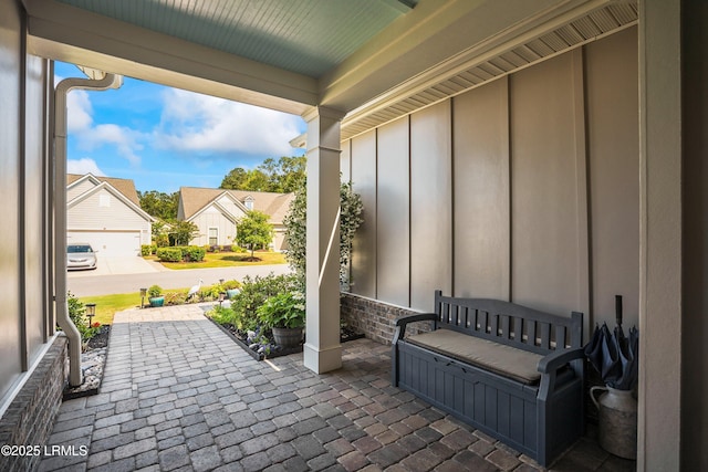 view of patio featuring a porch and a residential view