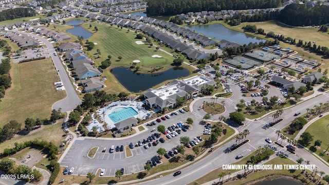 birds eye view of property featuring a water view and golf course view