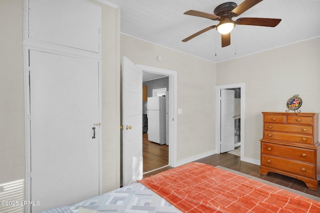 123 Moore St, Walterboro, SC 29488 - bedroom with freestanding refrigerator, dark wood-style floors, and ceiling fan