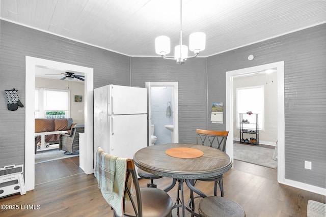 123 Moore St, Walterboro, SC 29488 - dining room featuring dark wood-type flooring, a chandelier, and a ceiling fan