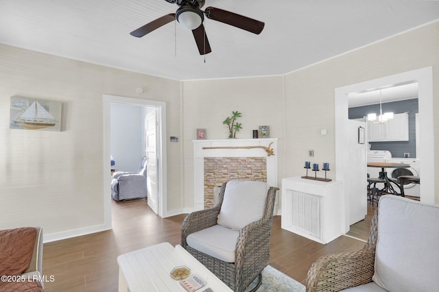 123 Moore St, Walterboro, SC 29488 - sitting room featuring wood finished floors, a ceiling fan, and a chandelier