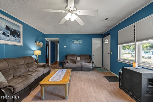 3003 Cherry Blvd, Beaufort, SC 29902 - living area featuring crown molding, wood finished floors, ceiling fan, baseboards, and a textured ceiling