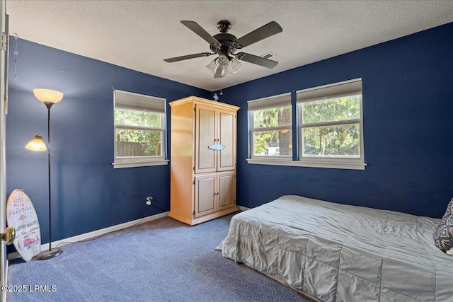 3003 Cherry Blvd, Beaufort, SC 29902 - carpeted bedroom with a textured ceiling, baseboards, and a ceiling fan
