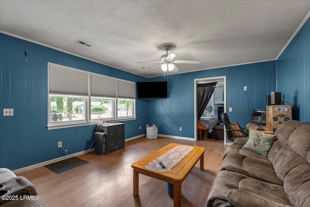 3003 Cherry Blvd, Beaufort, SC 29902 - living area featuring wood finished floors, ceiling fan, crown molding, a textured ceiling, and baseboards