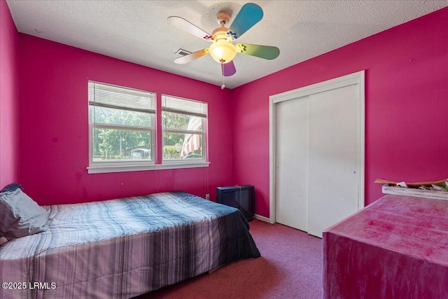 3003 Cherry Blvd, Beaufort, SC 29902 - bedroom with carpet, a closet, a ceiling fan, and a textured ceiling