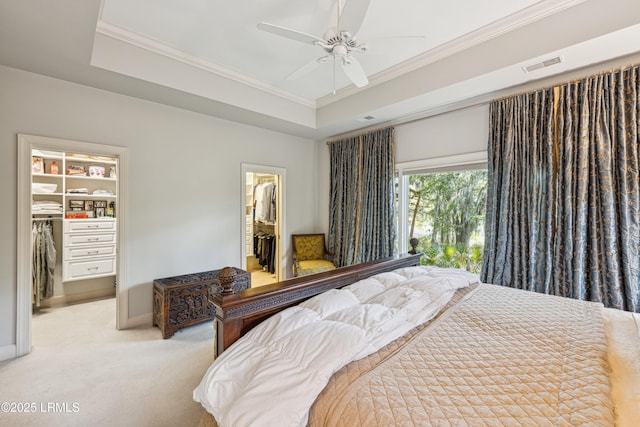 8 Chechessee Cir, Okatie, SC 29909 - bedroom featuring visible vents, a closet, a raised ceiling, ornamental molding, and a walk in closet