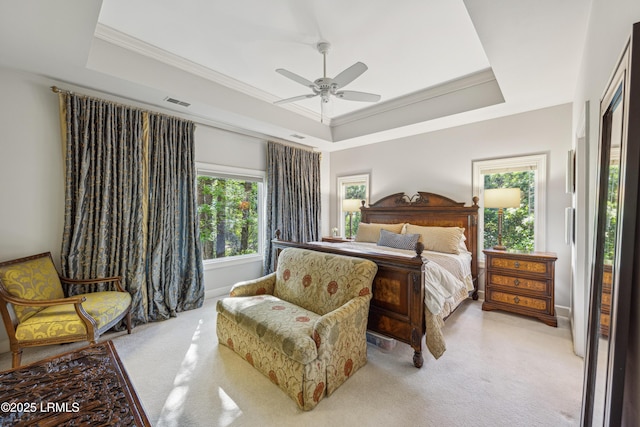 8 Chechessee Cir, Okatie, SC 29909 - carpeted bedroom featuring visible vents, a tray ceiling, crown molding, and a ceiling fan