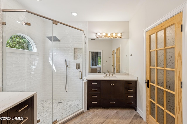 8 Chechessee Cir, Okatie, SC 29909 - ensuite bathroom with connected bathroom, vanity, recessed lighting, wood finished floors, and a stall shower