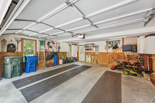 8 Chechessee Cir, Okatie, SC 29909 - garage with a wainscoted wall, wood walls, a garage door opener, and electric panel