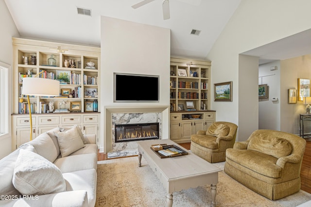 8 Chechessee Cir, Okatie, SC 29909 - living room featuring a premium fireplace, wood finished floors, a ceiling fan, and visible vents