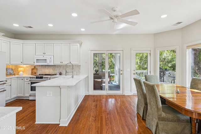 8 Chechessee Cir, Okatie, SC 29909 - kitchen featuring visible vents, white cabinetry, white appliances, and dark wood-style floors