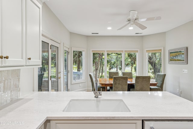 8 Chechessee Cir, Okatie, SC 29909 - kitchen featuring recessed lighting, a sink, white cabinets, and a wealth of natural light