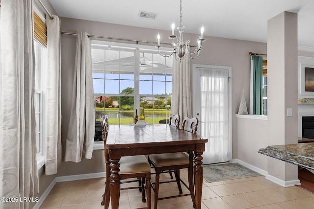 176 Pickett Mill Blvd, Bluffton, SC 29909 - dining room with a chandelier and light tile patterned floors