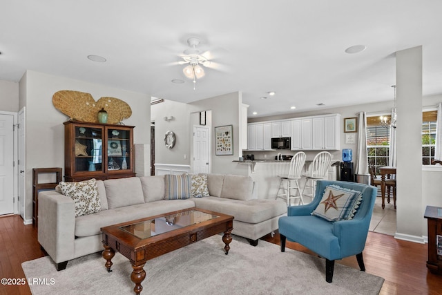 176 Pickett Mill Blvd, Bluffton, SC 29909 - living room with dark wood finished floors, a ceiling fan, a chandelier, and recessed lighting