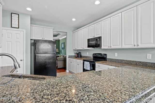 176 Pickett Mill Blvd, Bluffton, SC 29909 - kitchen with black appliances, recessed lighting, white cabinets, and dark stone counters