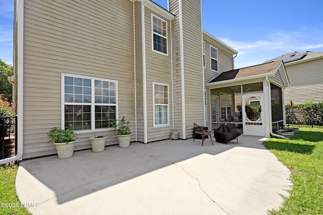 176 Pickett Mill Blvd, Bluffton, SC 29909 - back of house featuring a patio area, a chimney, and a sunroom
