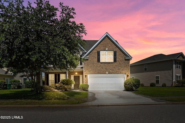 176 Pickett Mill Blvd, Bluffton, SC 29909 - traditional home featuring brick siding, concrete driveway, a garage, and a front yard