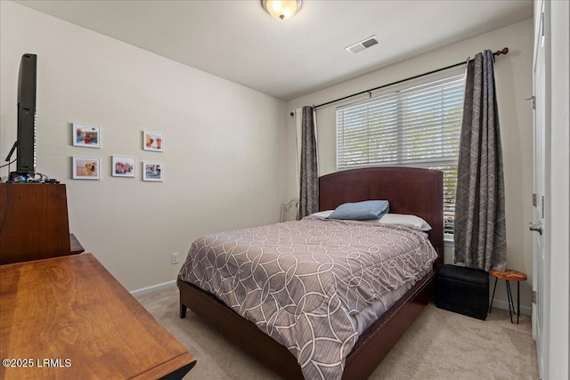 bedroom with light carpet