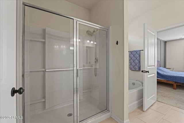 bathroom featuring separate shower and tub