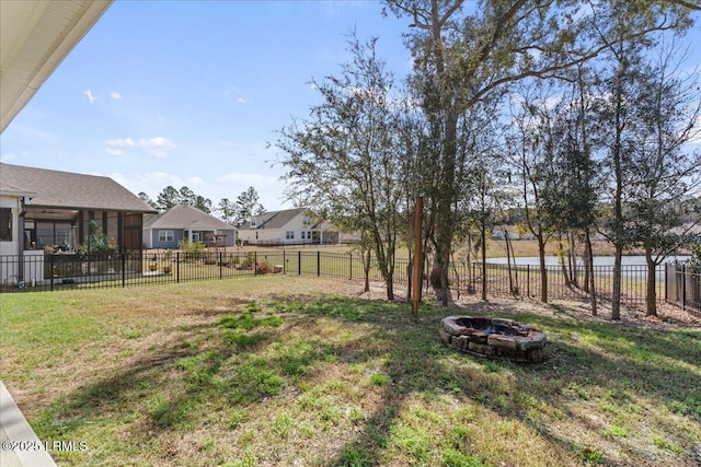 view of yard featuring an outdoor fire pit